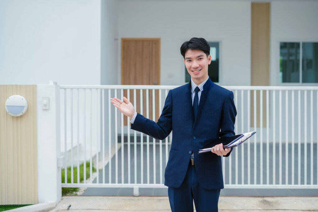 Real estate agent showing a villa property to buyers