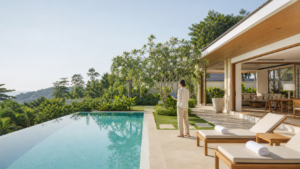 Villa manager checking a tropical villa before guest arrival in Thailand